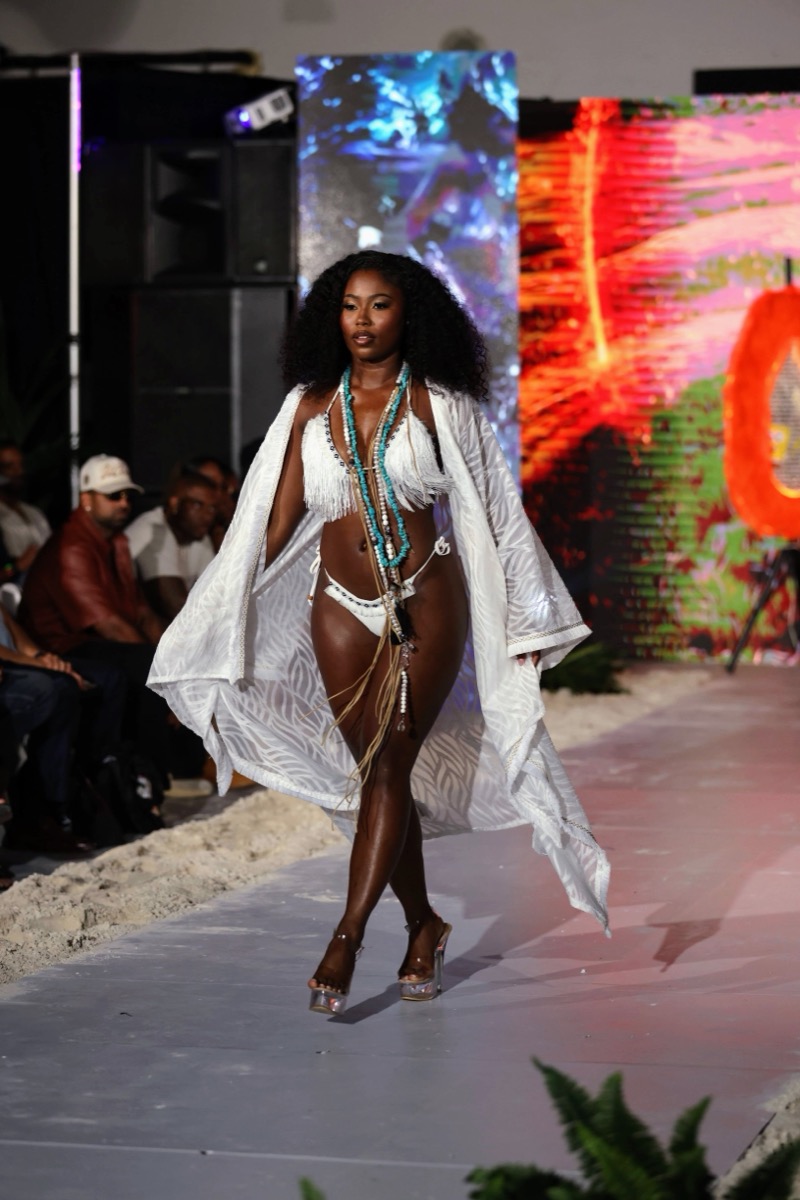 Runway model wearing white coastal swimwear at CurrentSeas Swim Week